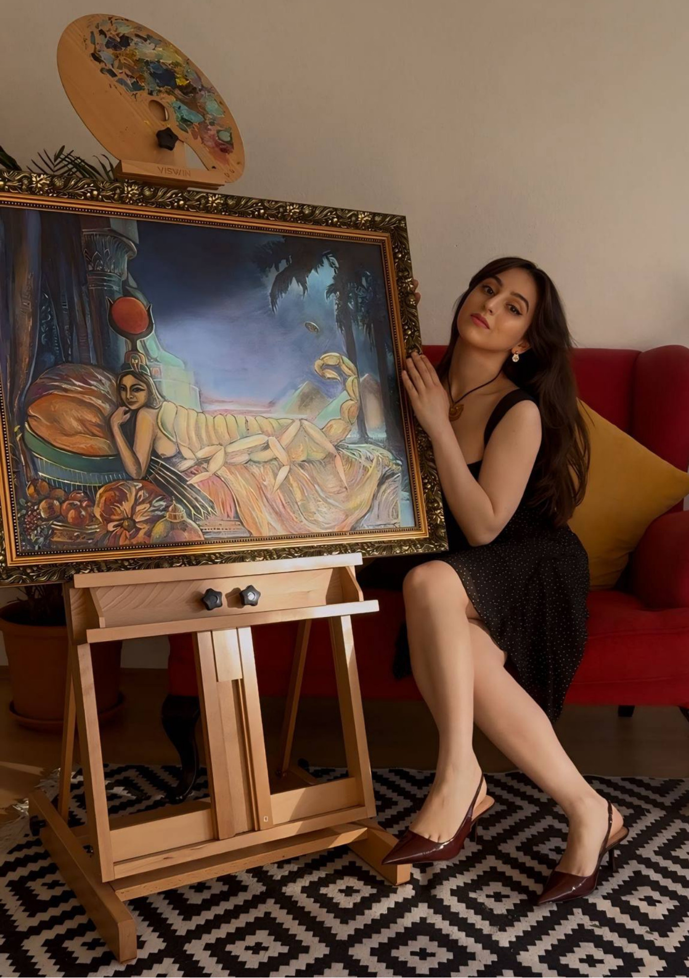 Günay Najafzade with her painting of the Scorpion Goddess